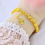 Women's Gold-Tone Lucky Four-Leaf Clover Bracelet – Featuring a 3D Openwork Clover Design and Adjustable Heart-Shaped Tag; Exquisite, Elegant Jewelry Perfect for Gifting. - Image 2